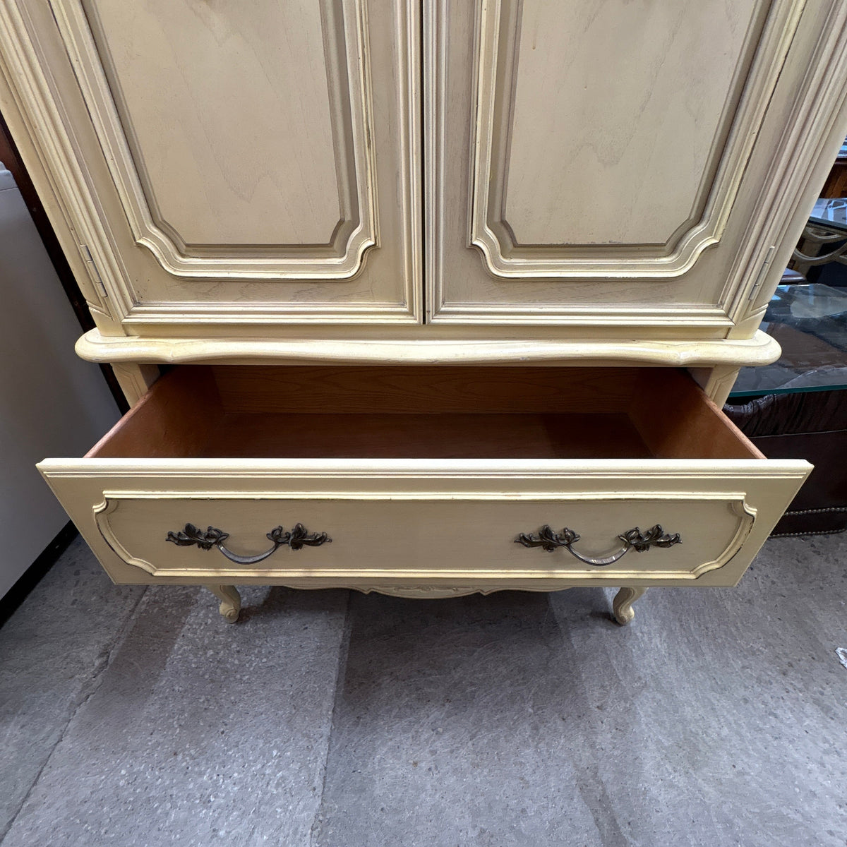 Stanley French Prov Armoire - paneled upper doors closed above the open top drawer