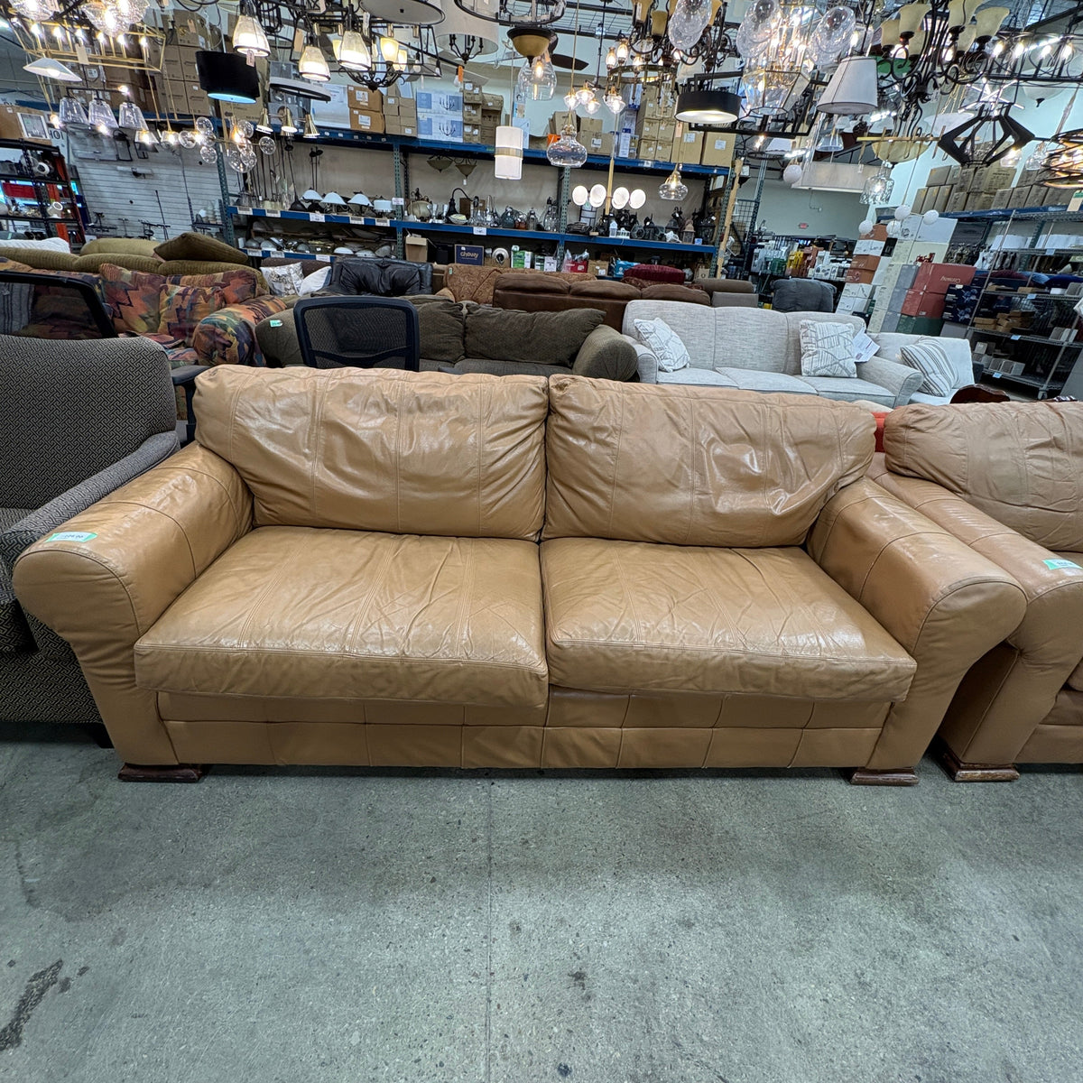 Tan Leather Sofa - front view showing the rolled arms and both seat cushions