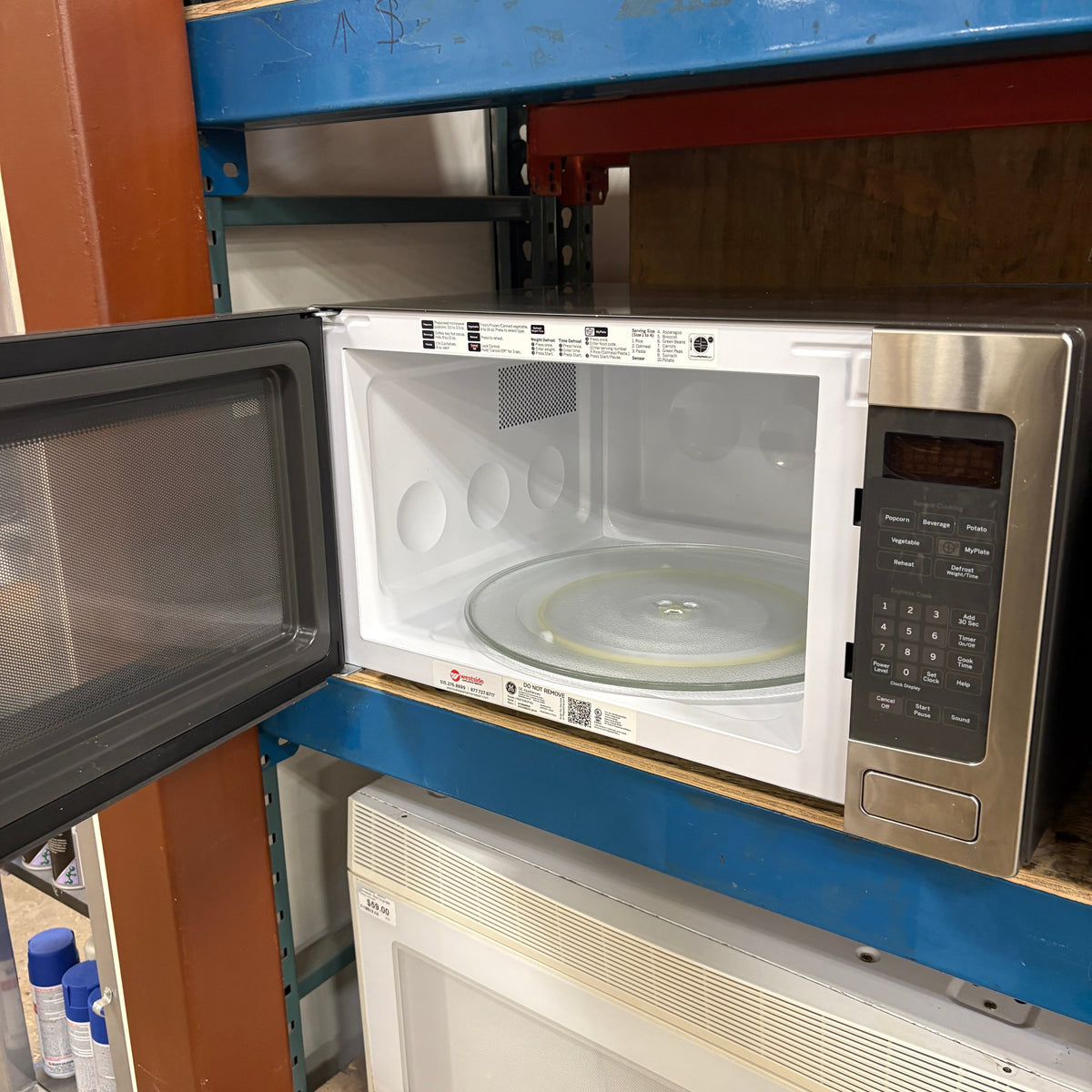 GE Sensor Cook Microwave - door open showing the white interior and glass turntable