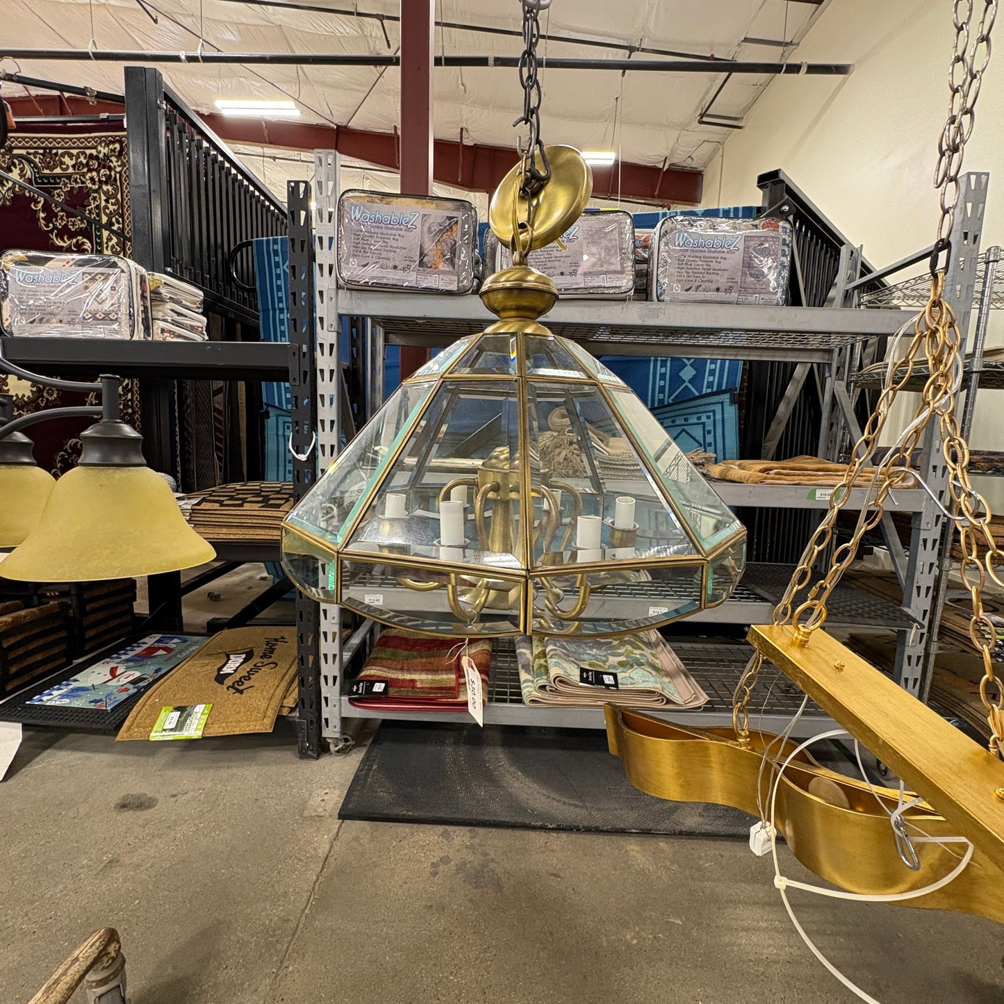 GDM Habitat for Humanity ReStore brass and glass geometric pendant chandelier hanging in a retail warehouse
