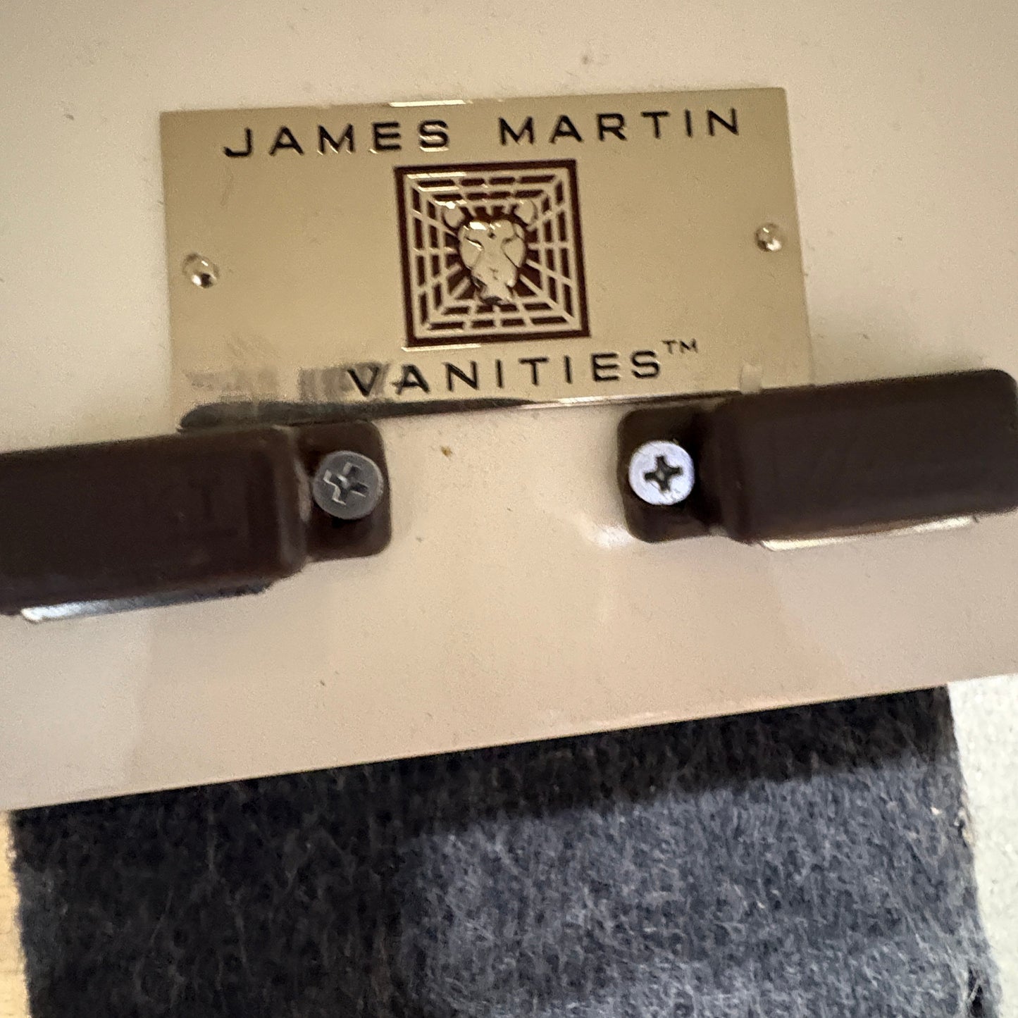 GDM Habitat for Humanity ReStore James Martin Vanities gold metal brand logo plate with brown magnetic door catches