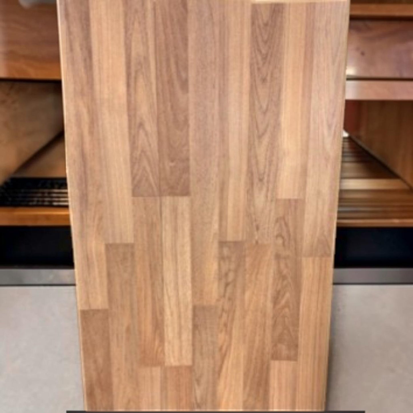 GDM Habitat for Humanity ReStore Soho Teak laminate flooring plank with a realistic wood grain pattern