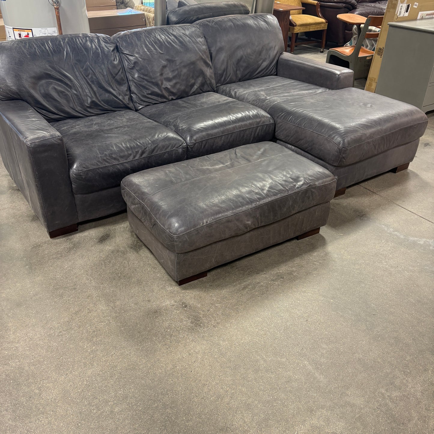 Gray Leather Sofa & Ottoman.