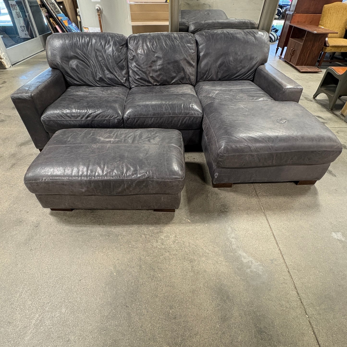 Gray Leather Sofa & Ottoman.