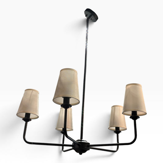 Six-Light Black Chandelier with Cream Tapered Shades at the Urbandale Habitat ReStore