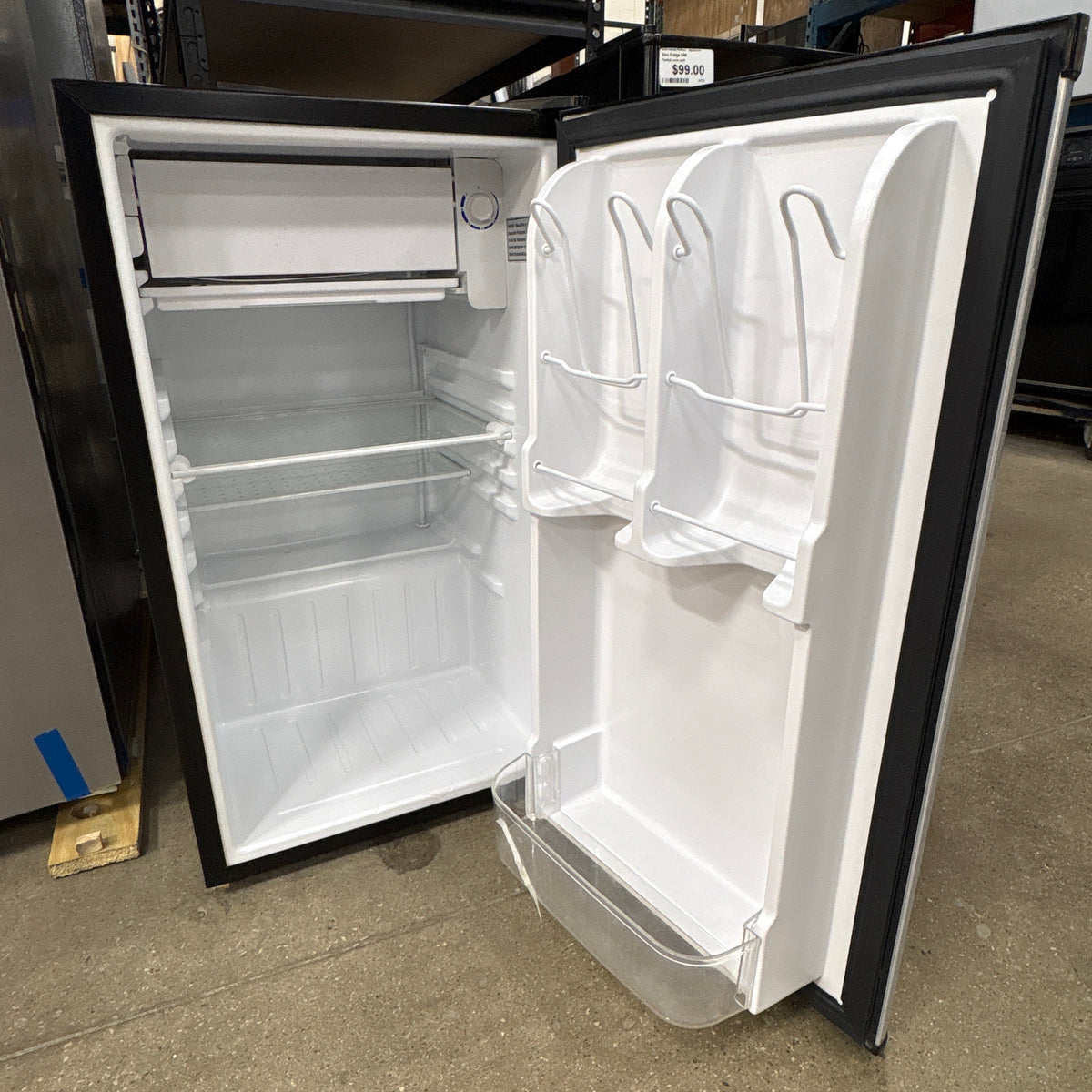 Haier Compact Mini Fridge - interior with shelving and door bins, door open