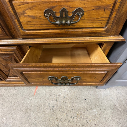 Oak Triple Dresser with Mirror - upper drawer open with brass batwing pulls