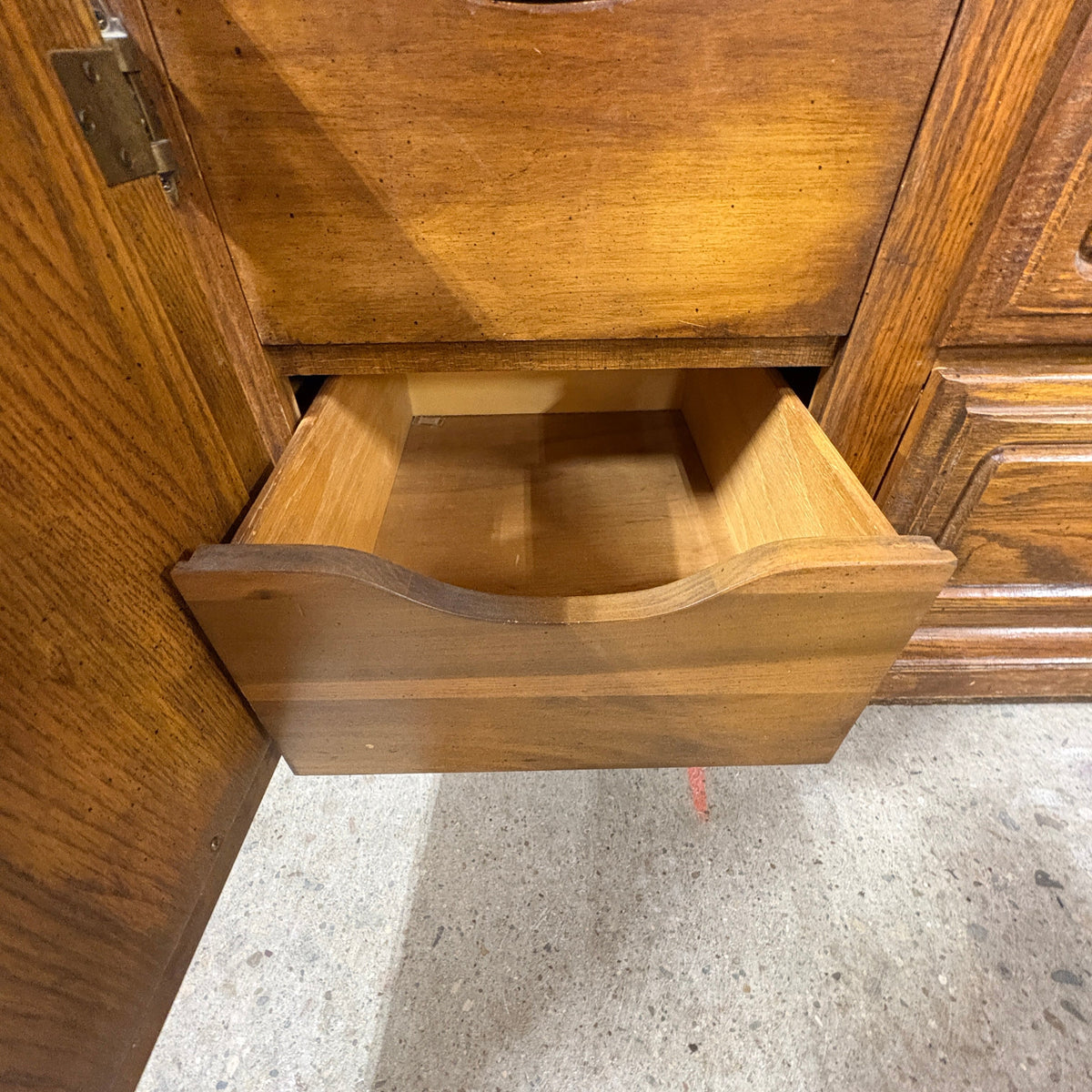 Oak Triple Dresser with Mirror - interior scoop-front drawer removed from the cabinet