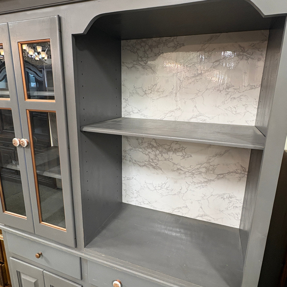 Gray 2 Pc China Hutch Glass - open side of the upper hutch with two shelves against the faux-marble back panel