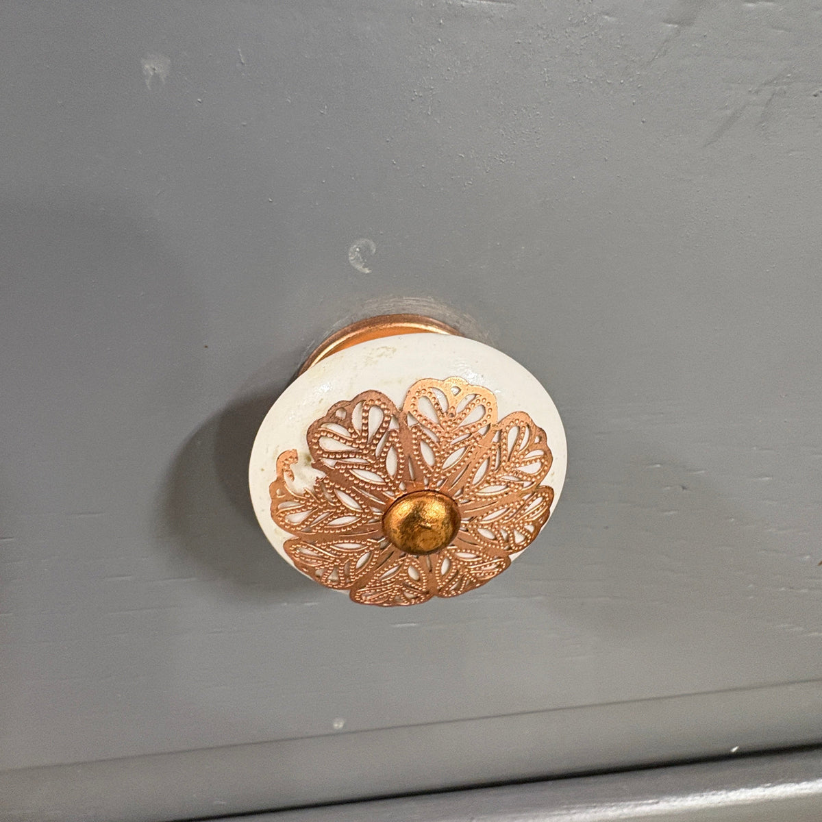 Gray 2 Pc China Hutch Glass - close-up of the painted ceramic floral knob