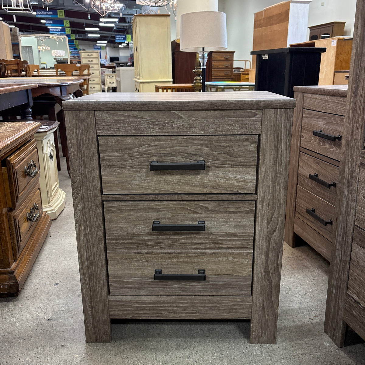Ashley 2 Drawer Night Stand - front view of the night stand on the sales floor