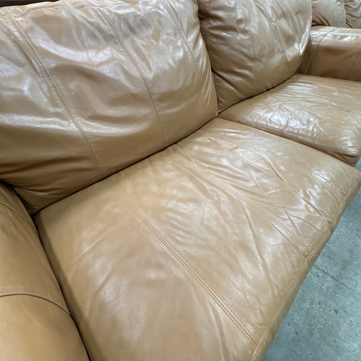 Tan Leather Sofa - close-up of the seat and back cushion leather