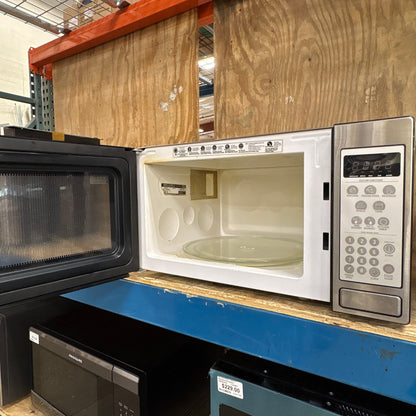 GE Turntable Microwave - door open showing the white interior and glass turntable