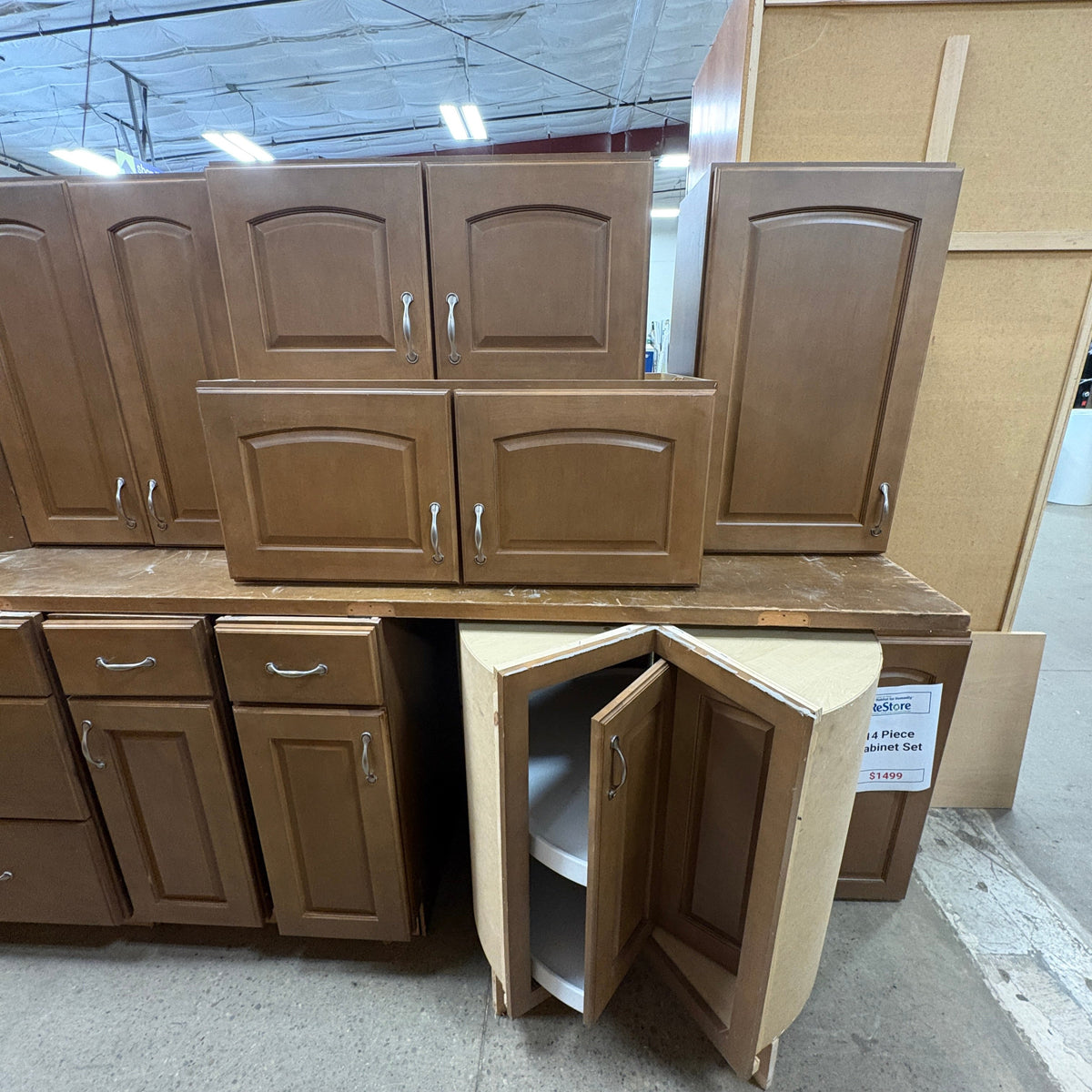 14 Pc Brown Cabinet Set - blind corner base cabinet with its bi-fold door swung open