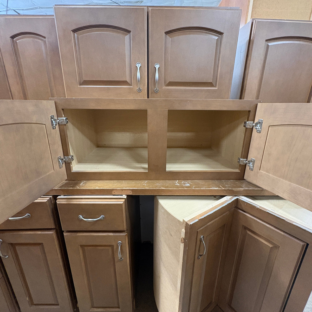 14 Pc Brown Cabinet Set - wall cabinets opened showing the empty interiors above the base run