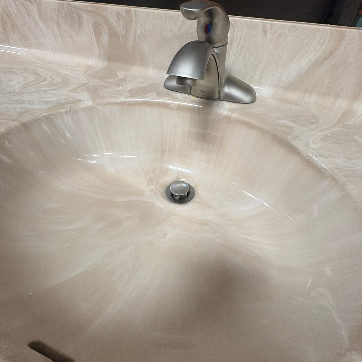 49 in Maple Vanity Set - close-up of the moulded sink bowl and the brushed-nickel faucet