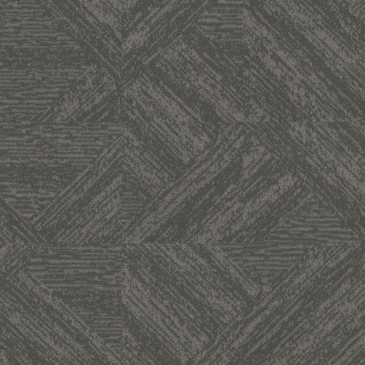 Bisect Sediment carpet tiles installed monolithic, forming diagonal stone-texture shapes