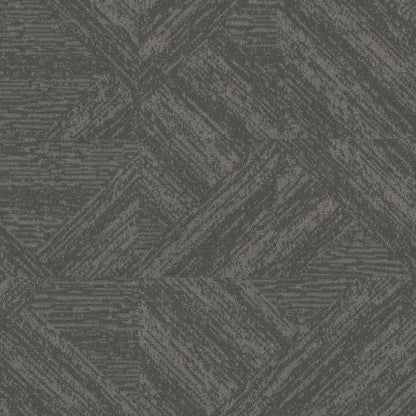Bisect Sediment carpet tiles installed monolithic, forming diagonal stone-texture shapes