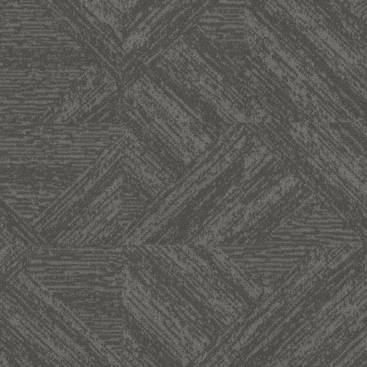 Bisect Sediment carpet tiles installed monolithic, forming diagonal stone-texture shapes