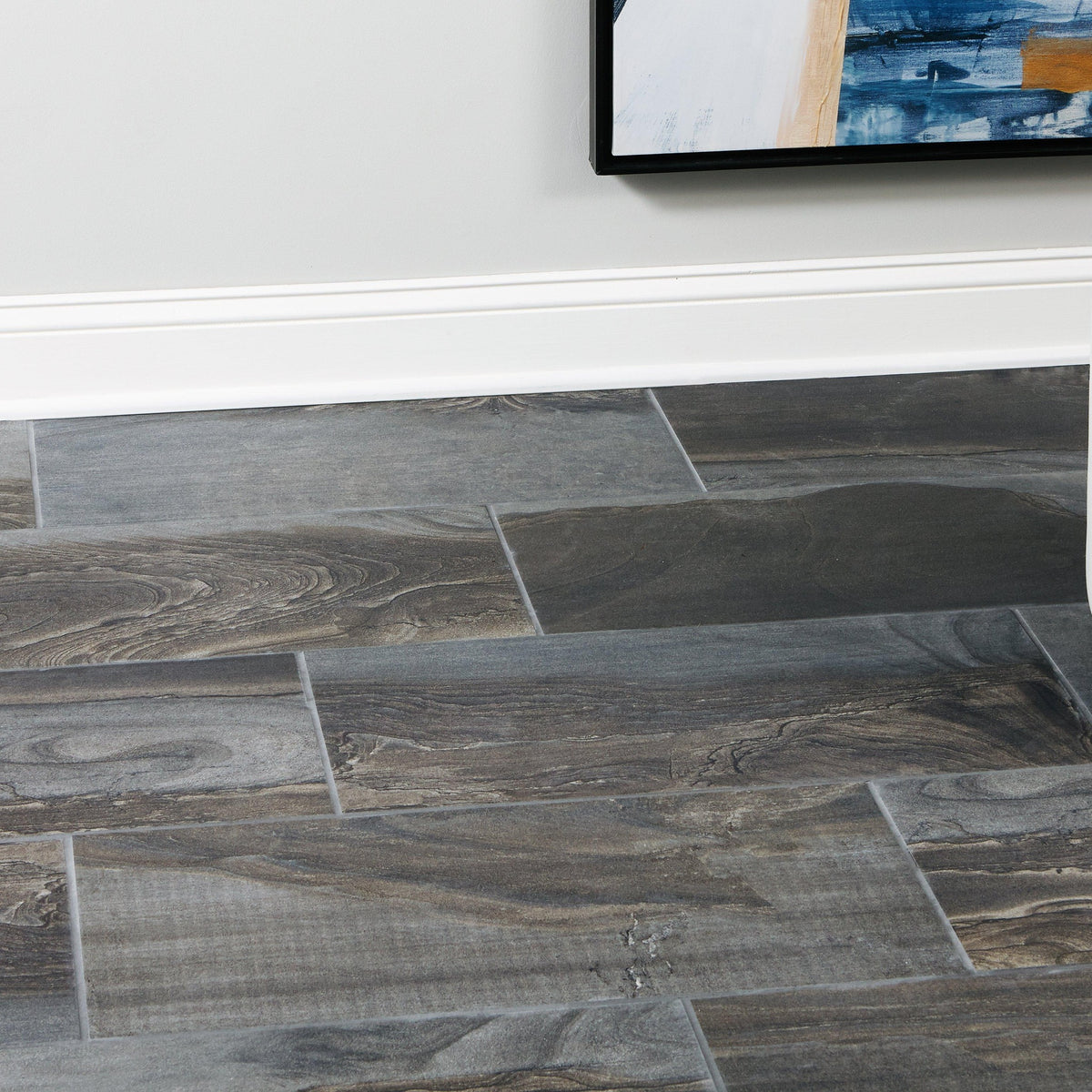 Fossil Smoke tile floor close-up along a baseboard