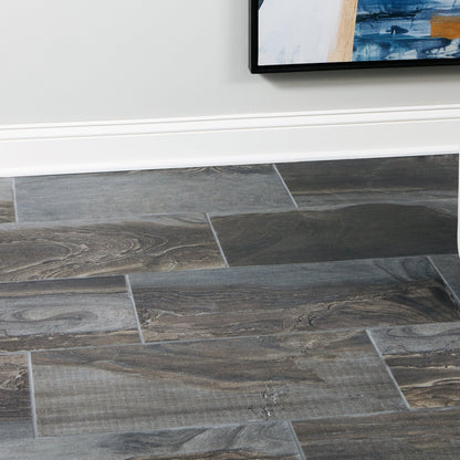 Fossil Smoke tile floor close-up along a baseboard
