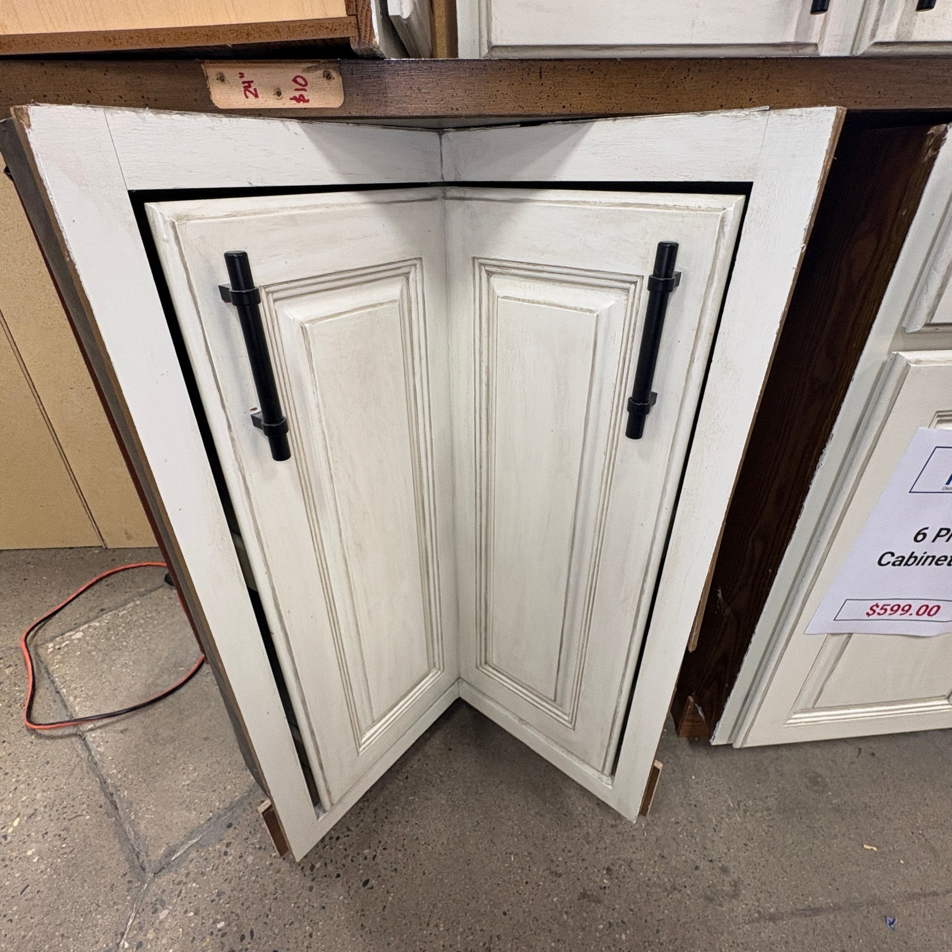 GDM Habitat for Humanity ReStore antique white corner kitchen cabinet doors with black modern bar handles