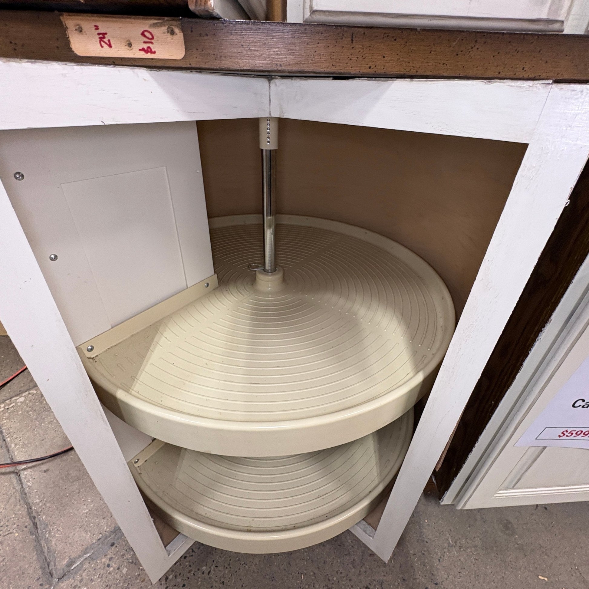GDM Habitat for Humanity ReStore antique white corner cabinet featuring a two-tier rotating plastic lazy susan shelf