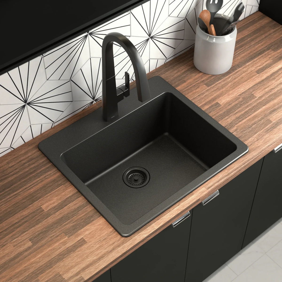 GDM Habitat for Humanity ReStore Moen black granite kitchen sink with a high-arc faucet on a wood countertop