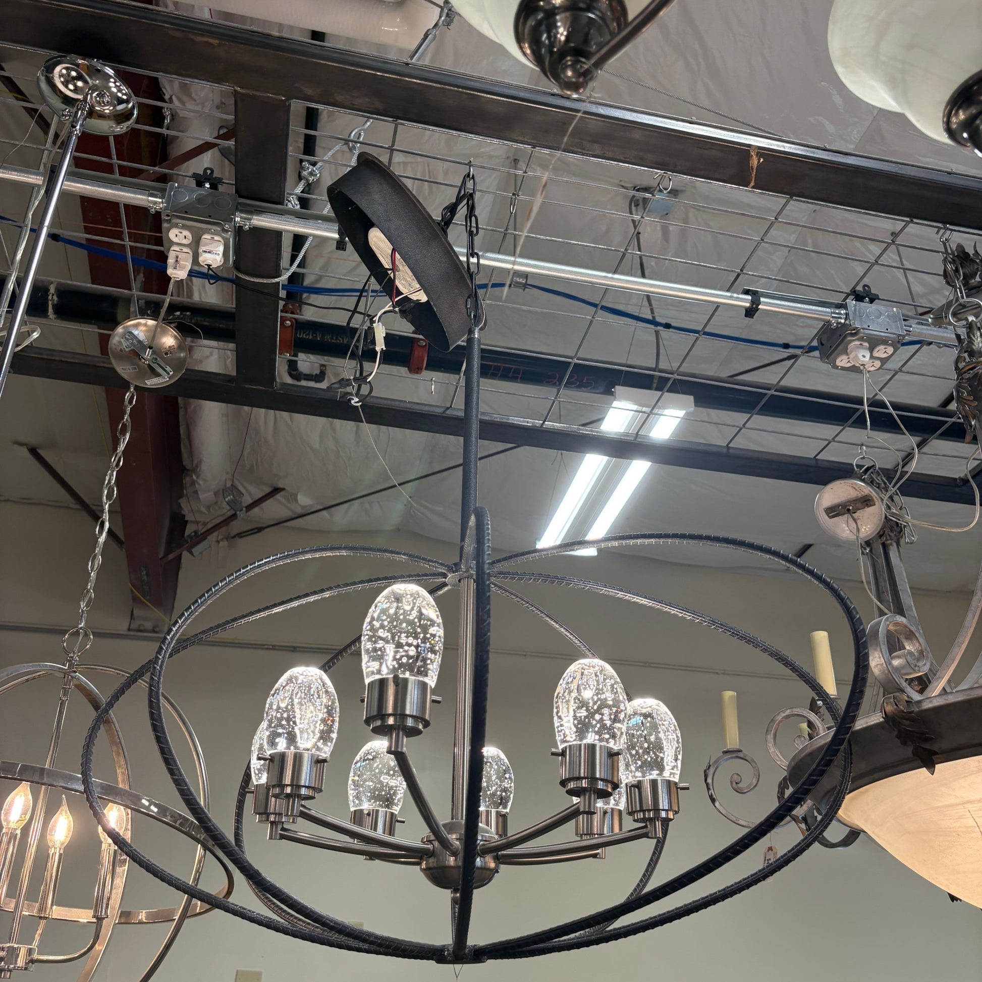 GDM Habitat for Humanity ReStore black rebar orb chandelier with six seeded glass bulb lights in a modern industrial style