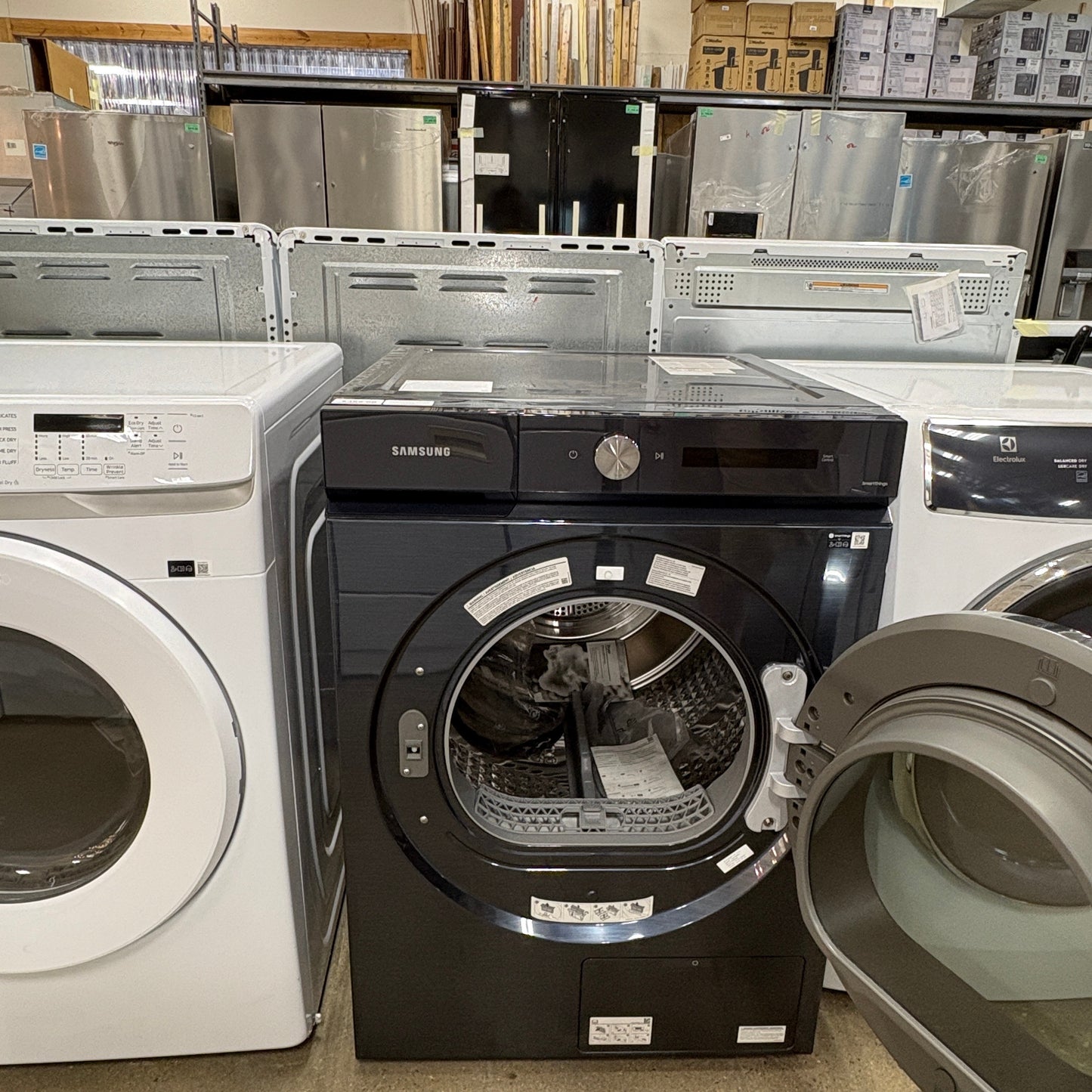 GDM Habitat for Humanity ReStore black Samsung front load dryer with open door in a retail appliance showroom