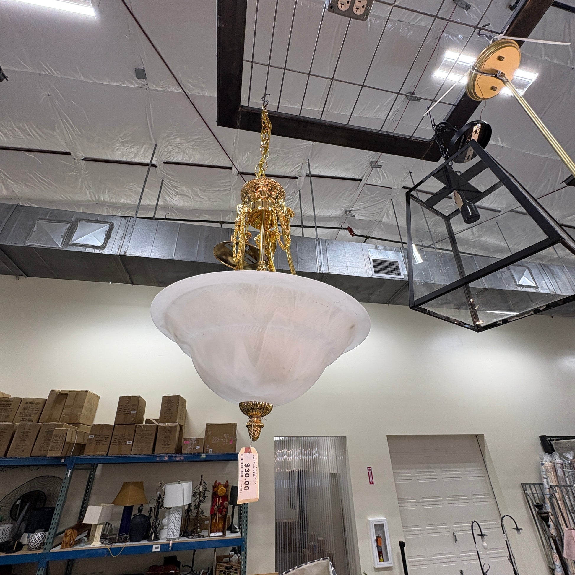 GDM Habitat for Humanity ReStore brass and frosted glass bowl pendant chandelier hanging in a warehouse store