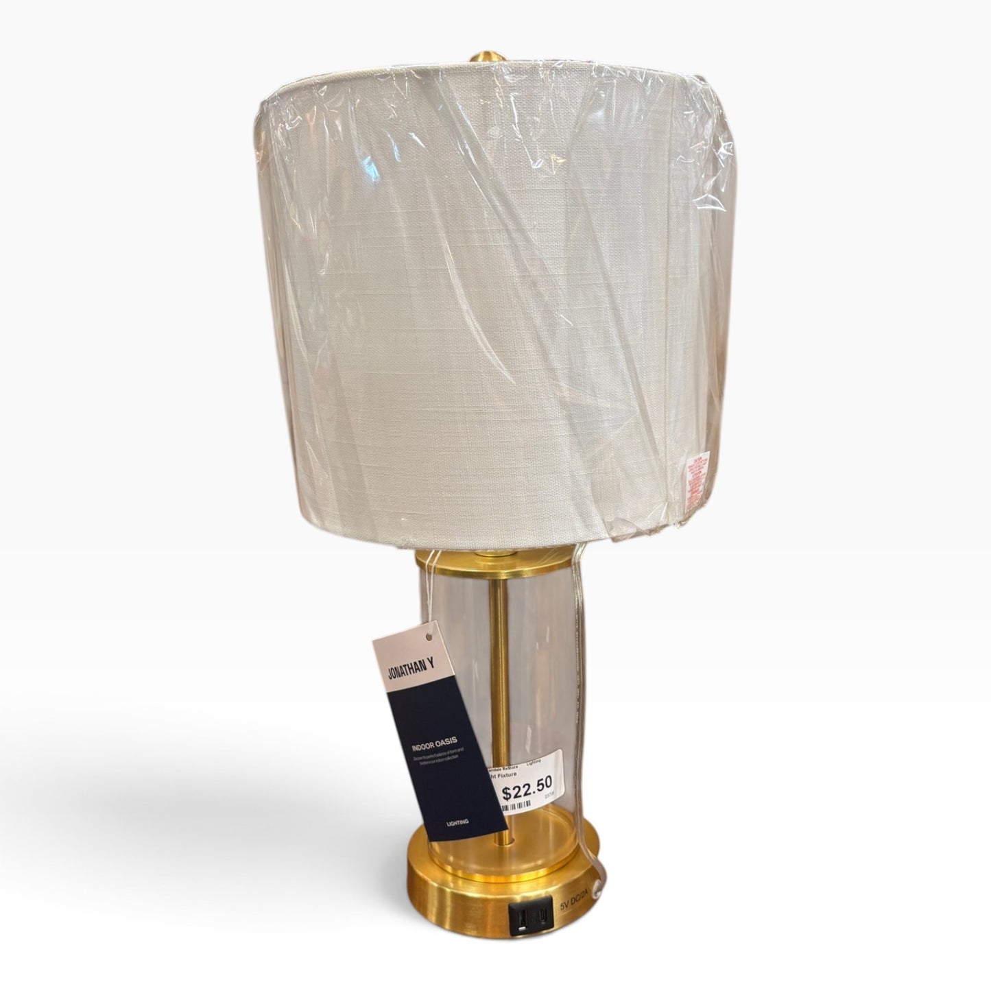 GDM Habitat for Humanity ReStore Jonathan Y brass table lamp with a clear glass base and white fabric drum shade