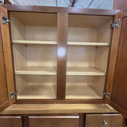 GDM Habitat for Humanity ReStore brown wooden kitchen cabinet with open doors and interior shelving
