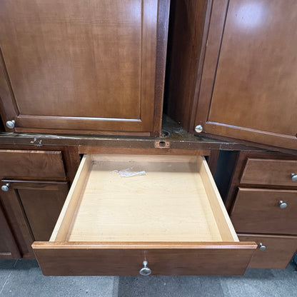 GDM Habitat for Humanity ReStore 13 piece brown wooden kitchen cabinet set with an open drawer and silver knobs