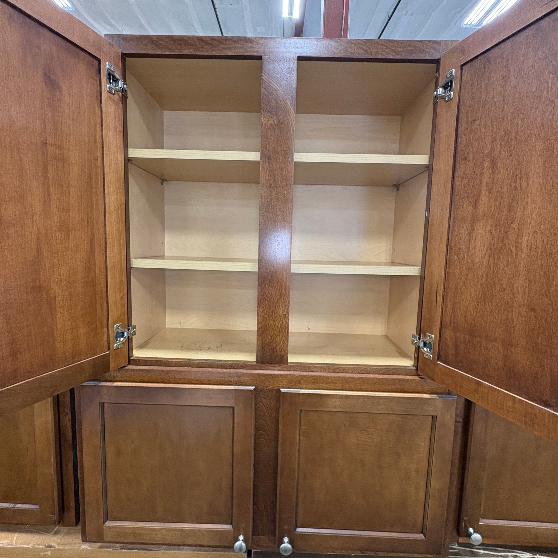 GDM Habitat for Humanity ReStore brown wooden kitchen cabinet set with open doors and interior shelving
