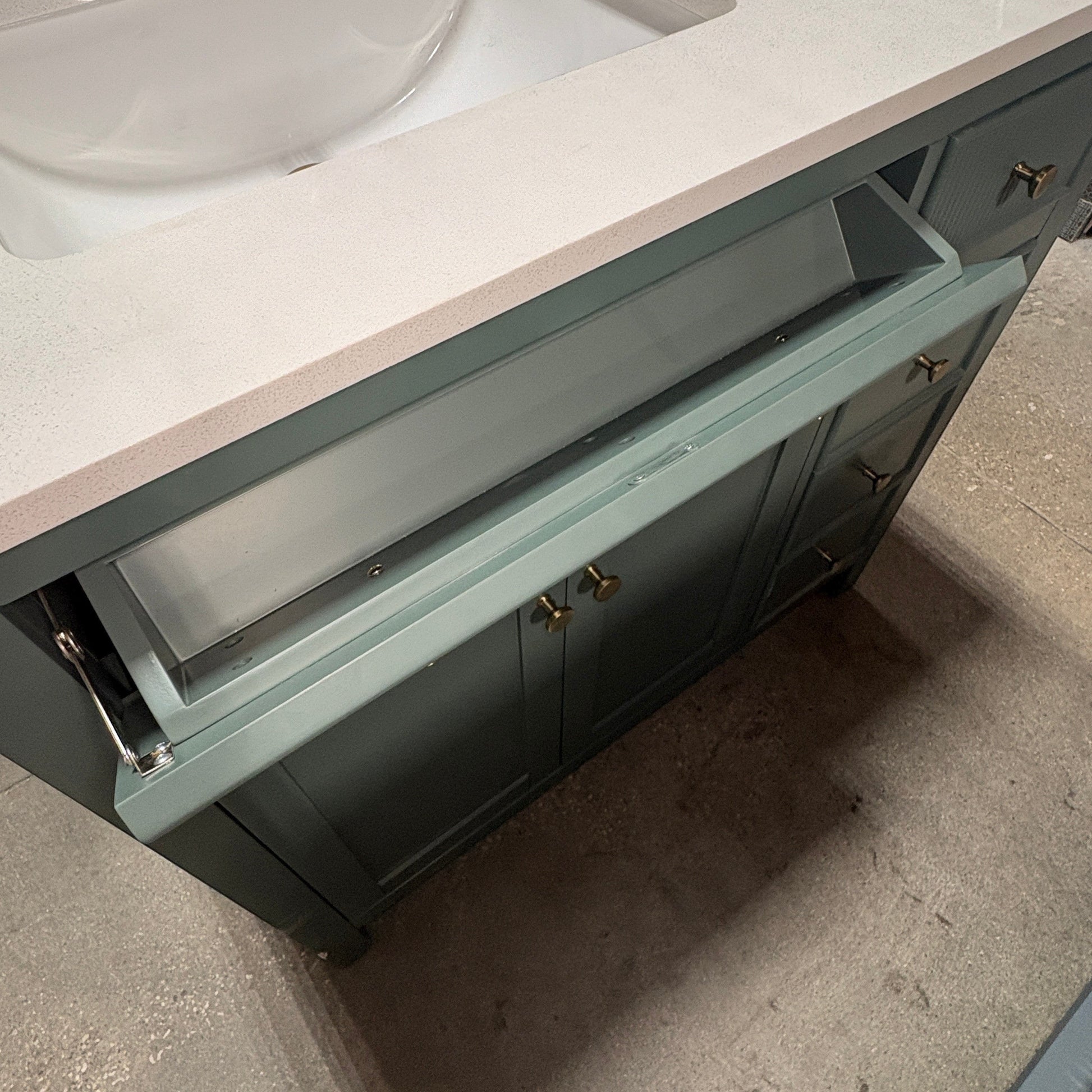 GDM Habitat for Humanity ReStore dark green fluted bathroom vanity with white countertop and brass hardware