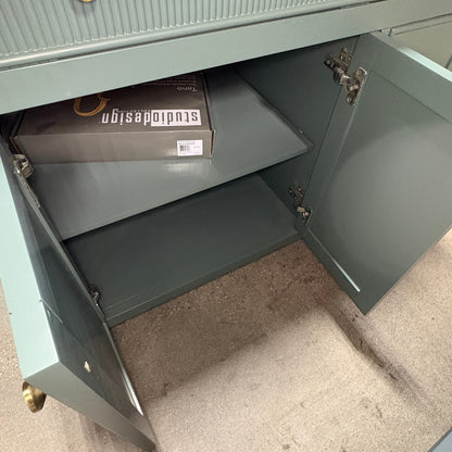 GDM Habitat for Humanity ReStore dark green fluted vanity cabinet with open doors showing interior shelf