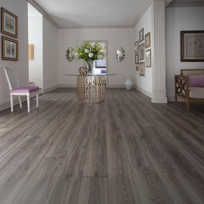GDM Habitat for Humanity ReStore Driftwood Oak laminate flooring in a bright, elegant home entryway.
