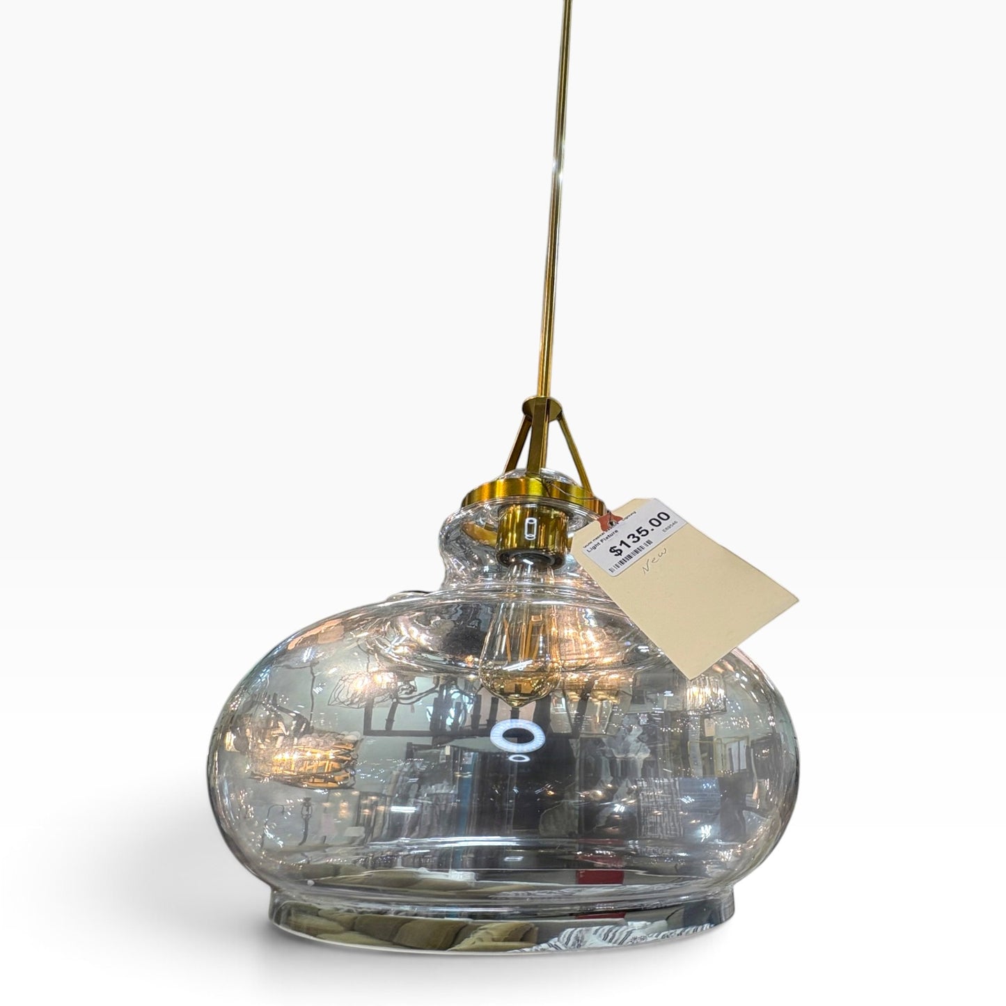 GDM Habitat for Humanity ReStore modern glass pendant light with a brass finish and rounded bulbous shade