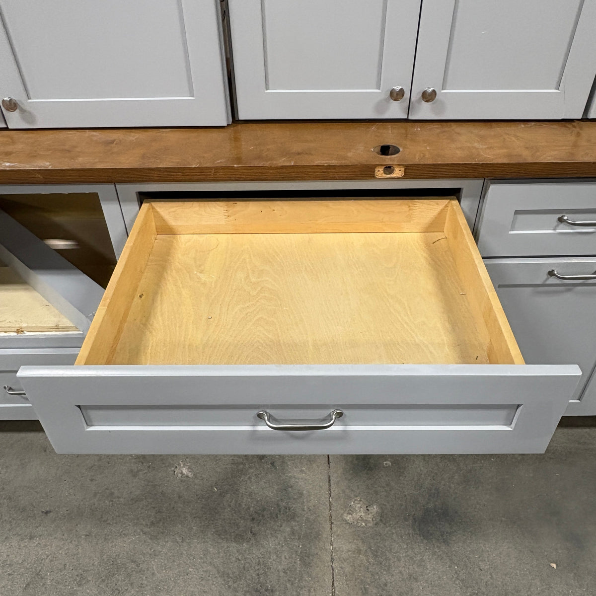 GDM Habitat for Humanity ReStore 15 pc gray cabinet set featuring a pull-out drawer with wood interior and metal pulls