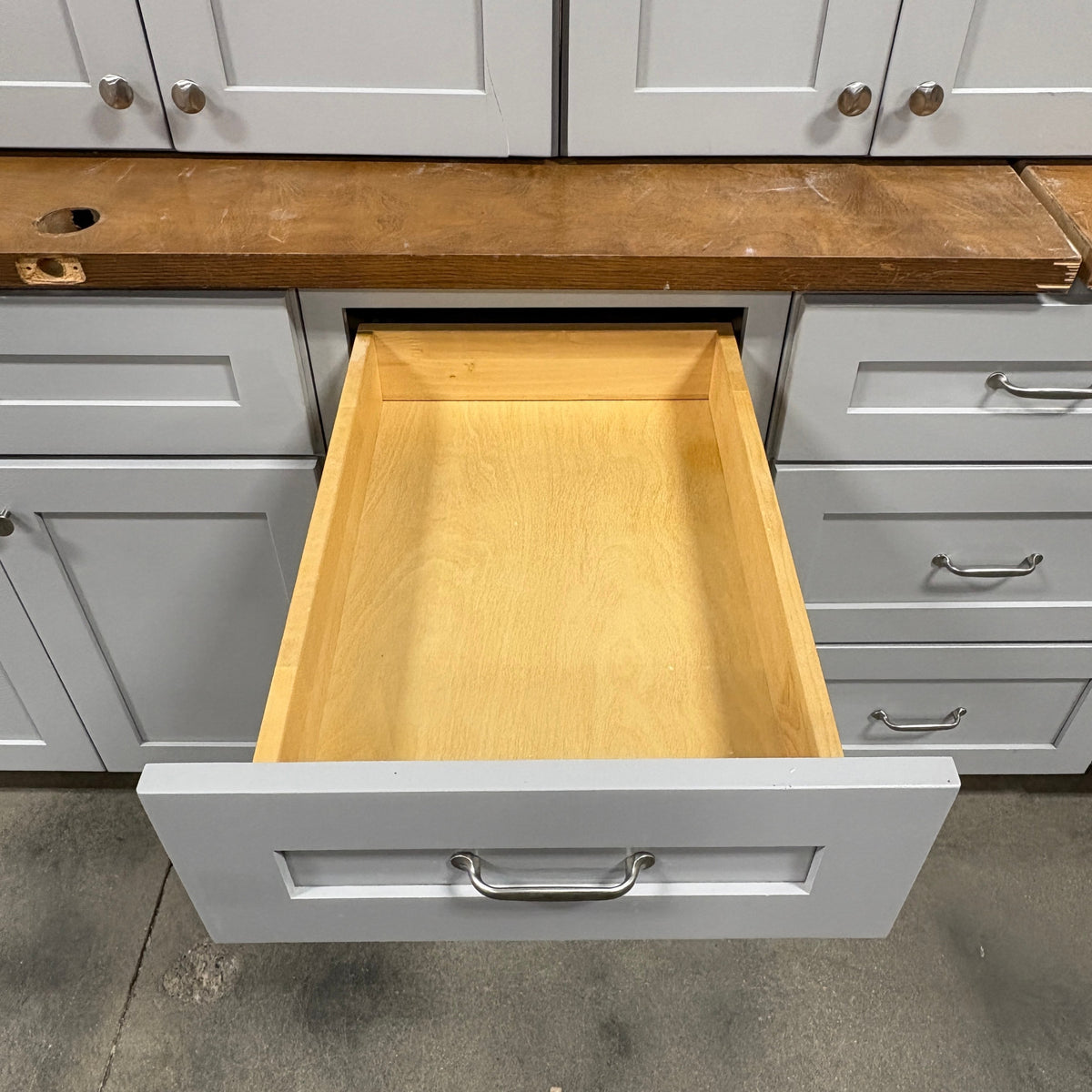 GDM Habitat for Humanity ReStore 15 pc gray cabinet set with open wooden drawer and silver metal handles