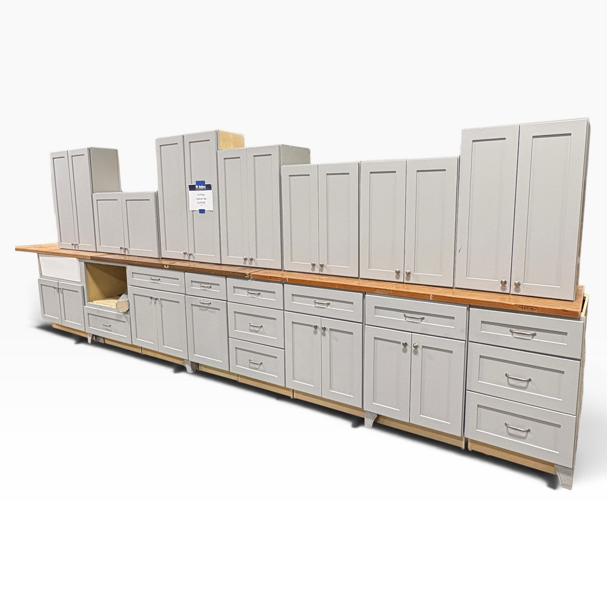 GDM Habitat for Humanity ReStore 15 piece gray kitchen cabinet set with shaker doors and drawers on a wood countertop