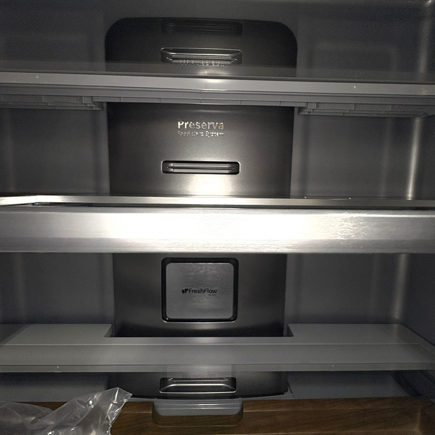 Interior of a GDM Habitat for Humanity ReStore KitchenAid French door fridge with Preserva food care system shelves