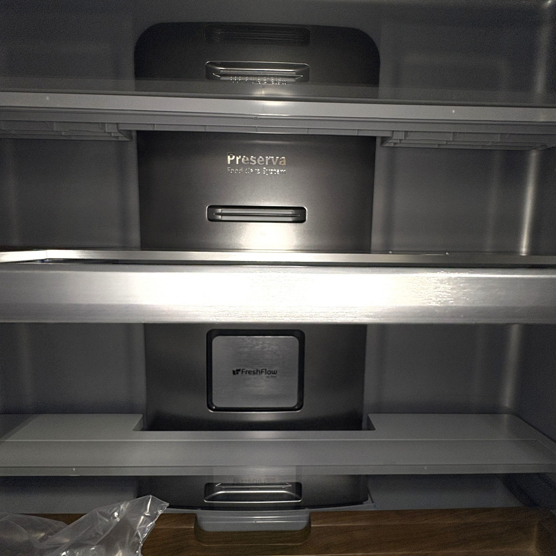 Interior of a GDM Habitat for Humanity ReStore KitchenAid French door fridge with Preserva food care system shelves