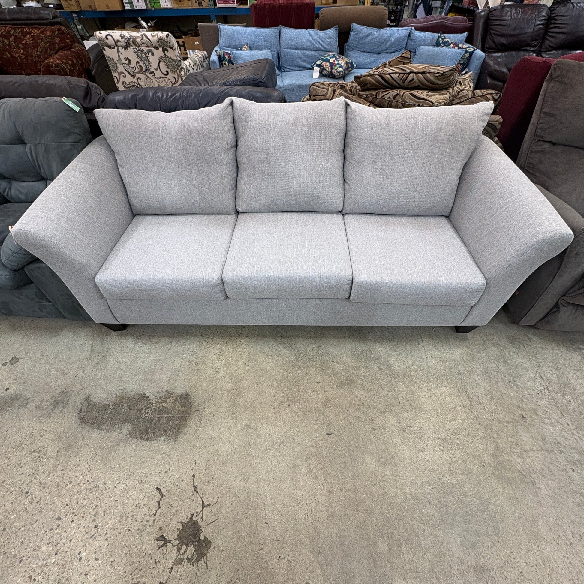 GDM Habitat for Humanity ReStore light gray three-seater sofa with flared arms and plush back cushions