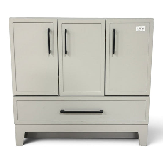 GDM Habitat for Humanity ReStore 36-inch light gray bathroom vanity base with shaker doors and black bar pulls.
