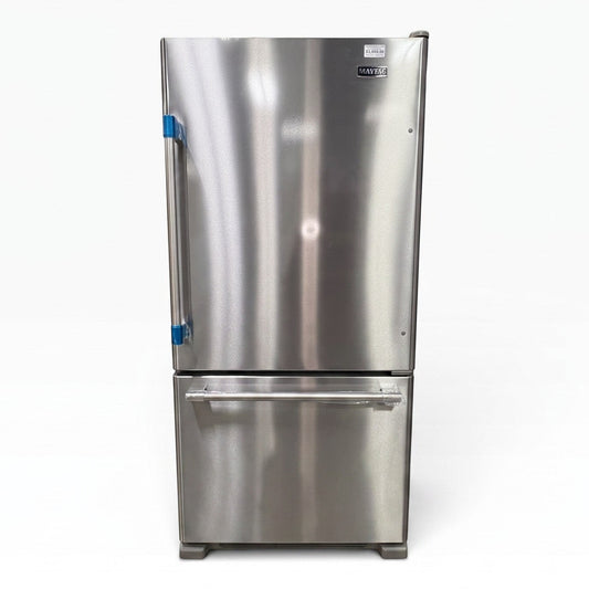GDM Habitat for Humanity ReStore stainless steel Maytag bottom-freezer refrigerator with protective factory plastic