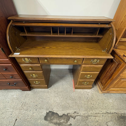 GDM Habitat for Humanity ReStore oak roll-top desk with multiple drawers and brass hardware in a classic wood finish