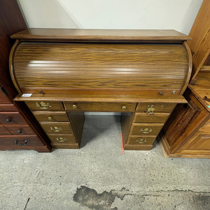 GDM Habitat for Humanity ReStore oak roll-top desk with multiple drawers and brass hardware in a vintage style