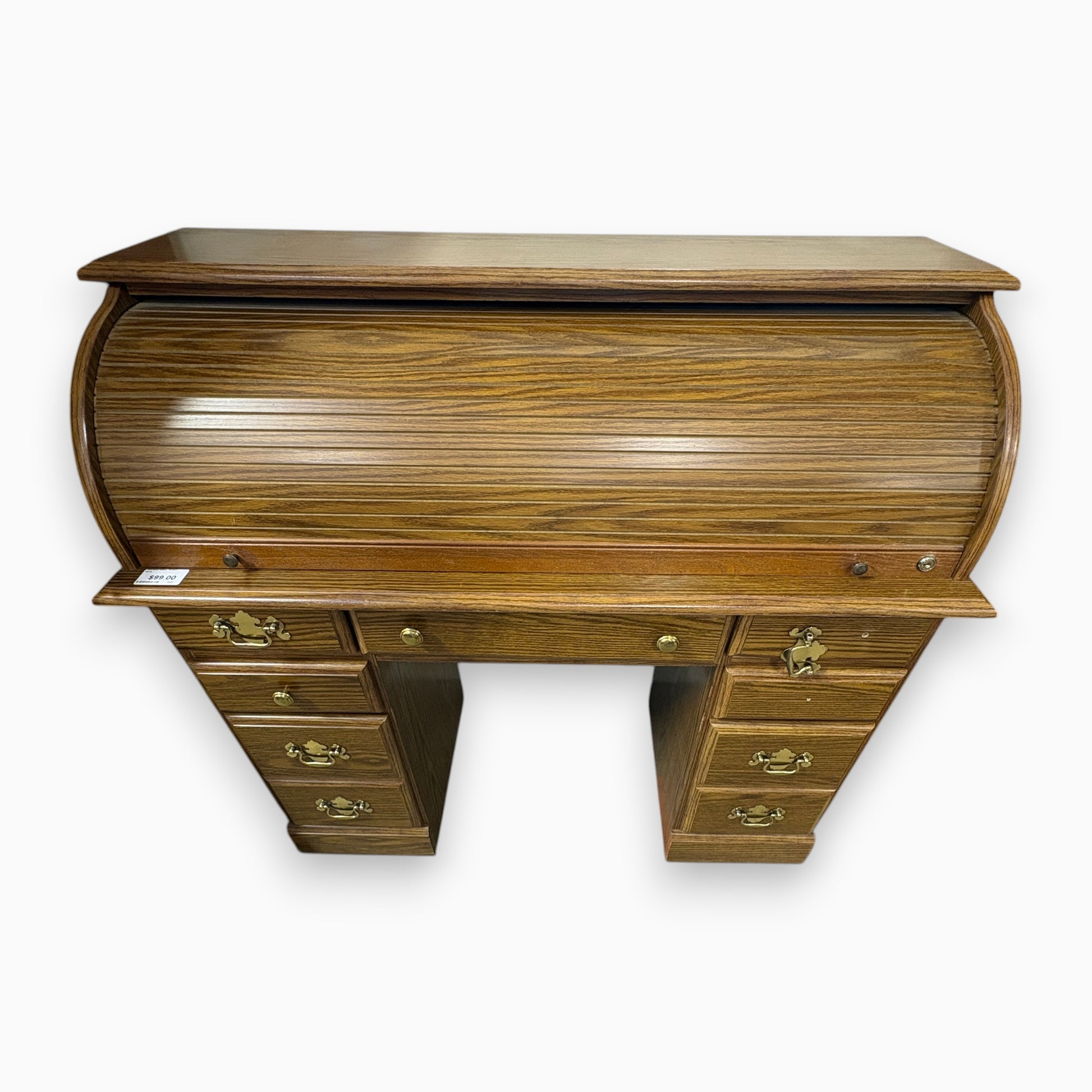 GDM Habitat for Humanity ReStore oak roll-top desk with multiple drawers and brass hardware in a traditional style